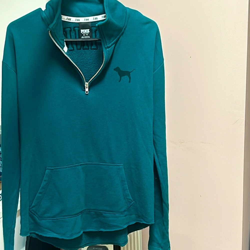Women’s xsmall half zip sweatshirt. Teal. Zebra stripe“pink” block lettering.